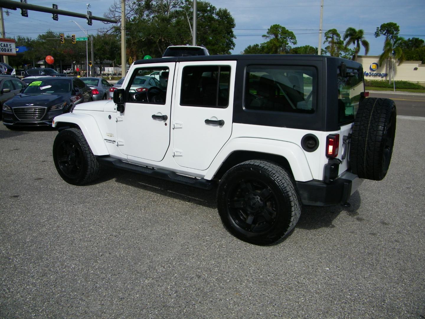 2015 White /Black Jeep Wrangler Unlimited Sahara 4WD (1C4BJWEGXFL) with an 3.6L V6 DOHC 24V FFV engine, Automatic transmission, located at 4000 Bee Ridge Road, Sarasota, FL, 34233, (941) 926-0300, 27.298664, -82.489151 - Photo#3